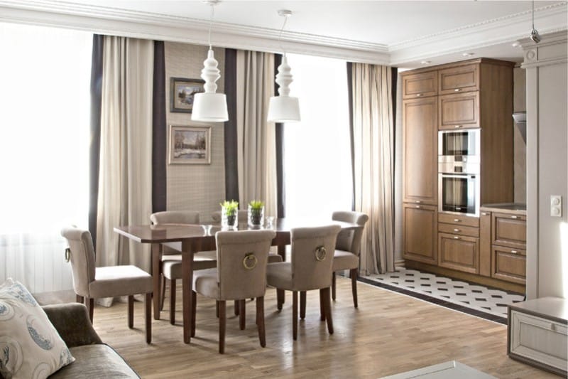 Kitchen-dining room sa beige at brown tones
