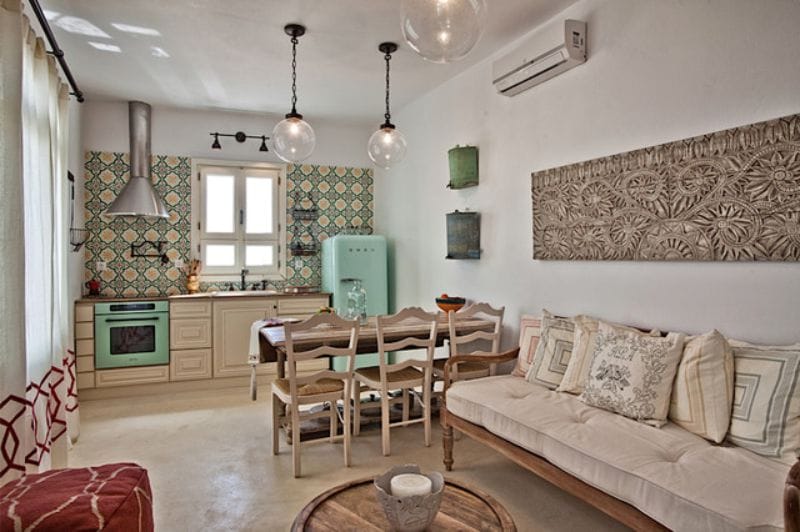 Mediterranean-style beige kitchen with blue accents