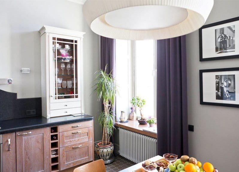 Neoclassical style kitchen na may dark purple curtains